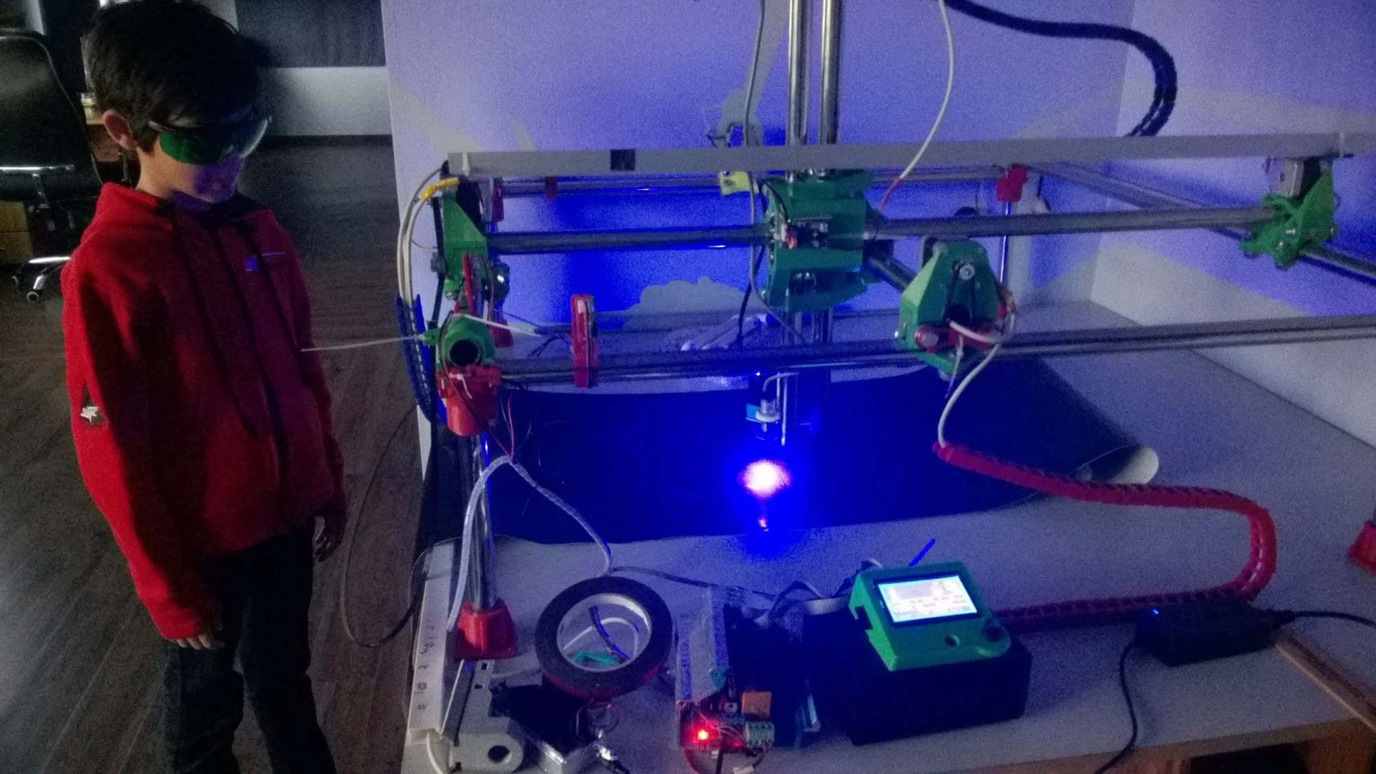 Patiently watching the laser cutting of the foil